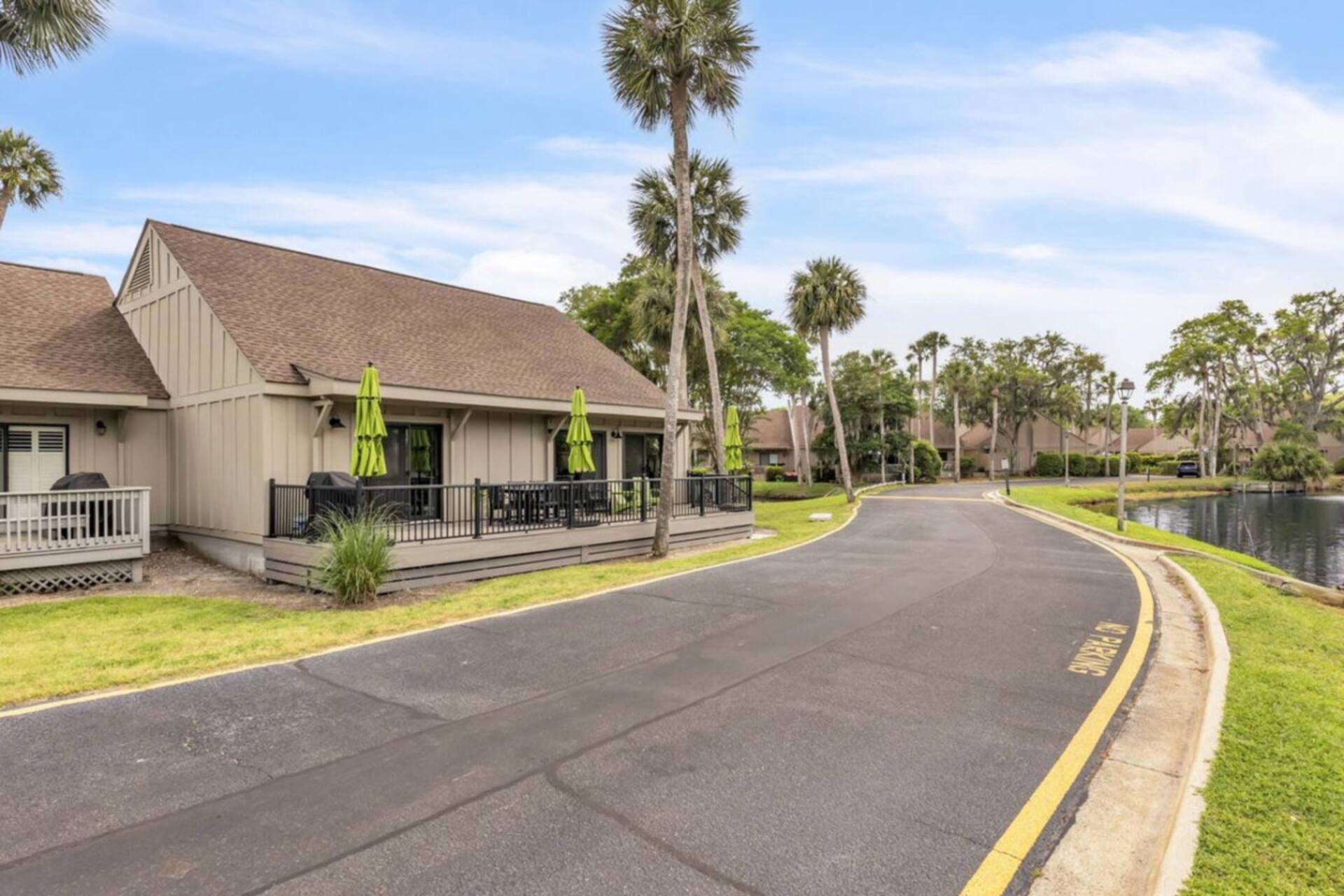 Quiet palm-lined street inside Queens Grant