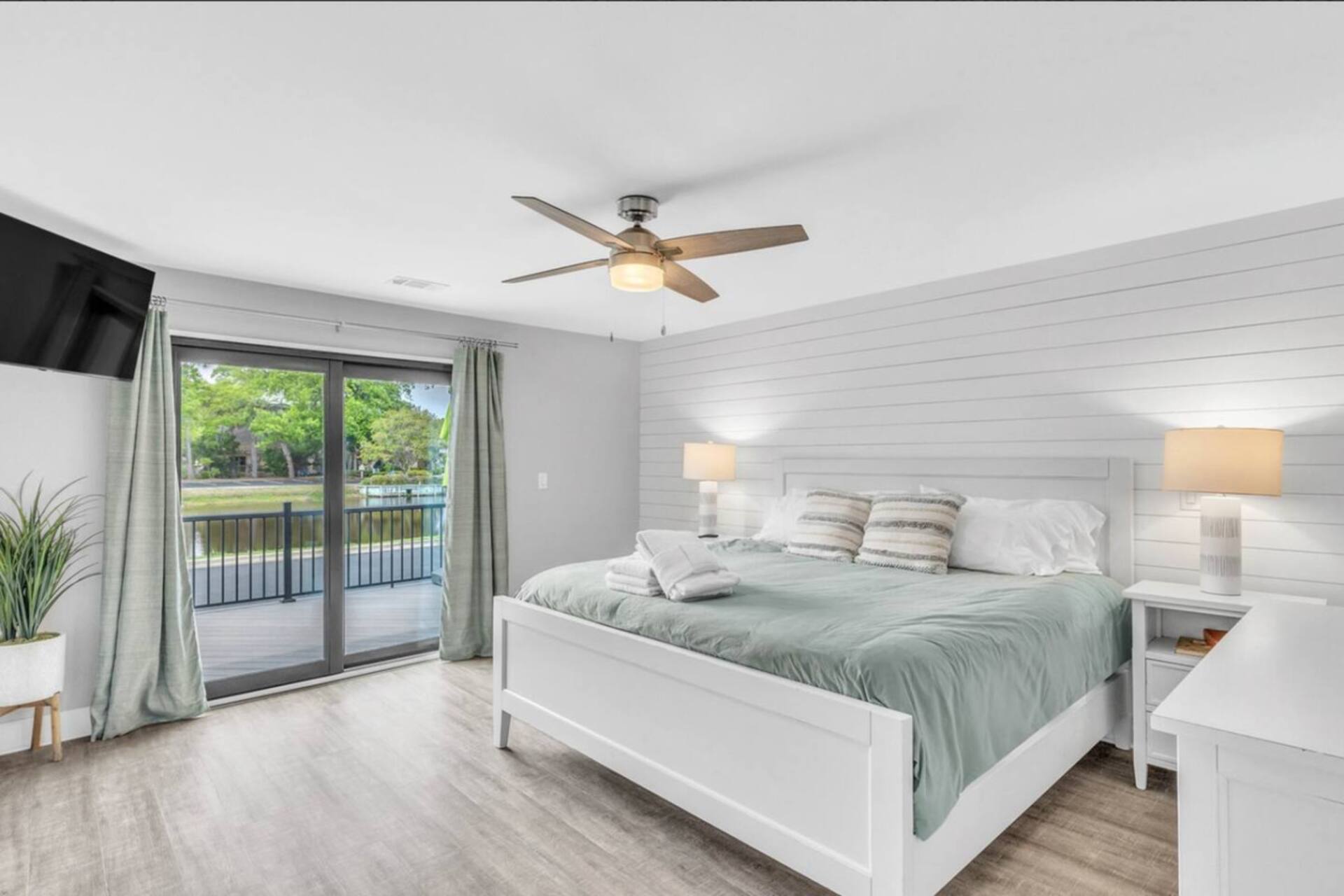 Primary bedroom with king bed and deck access