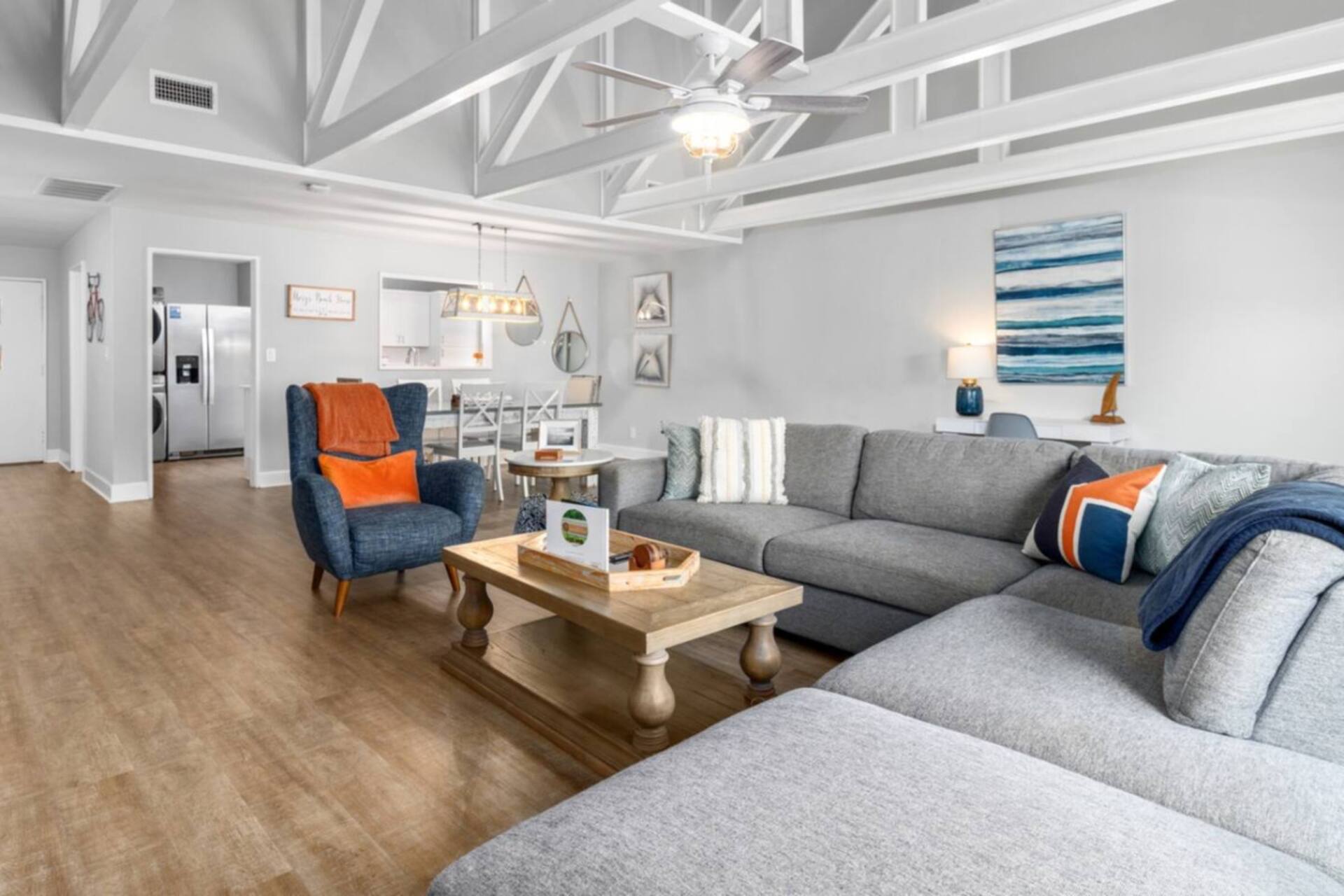 Bright living room with coastal artwork