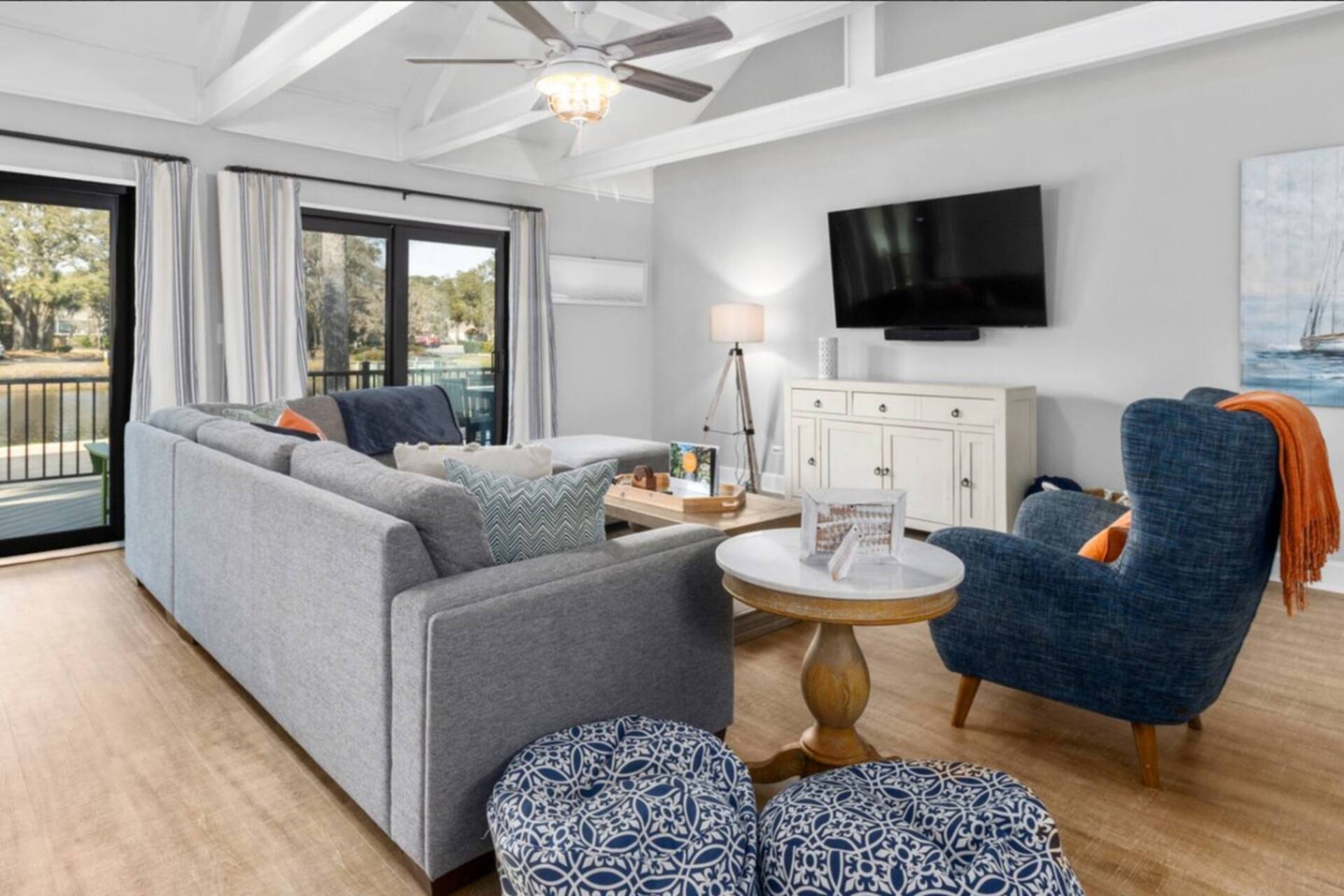 Open living room with sectional sofa and smart TV
